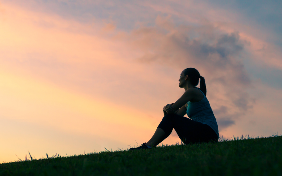 Woman gazing out to the horizon, possibly contemplating weight loss and shame