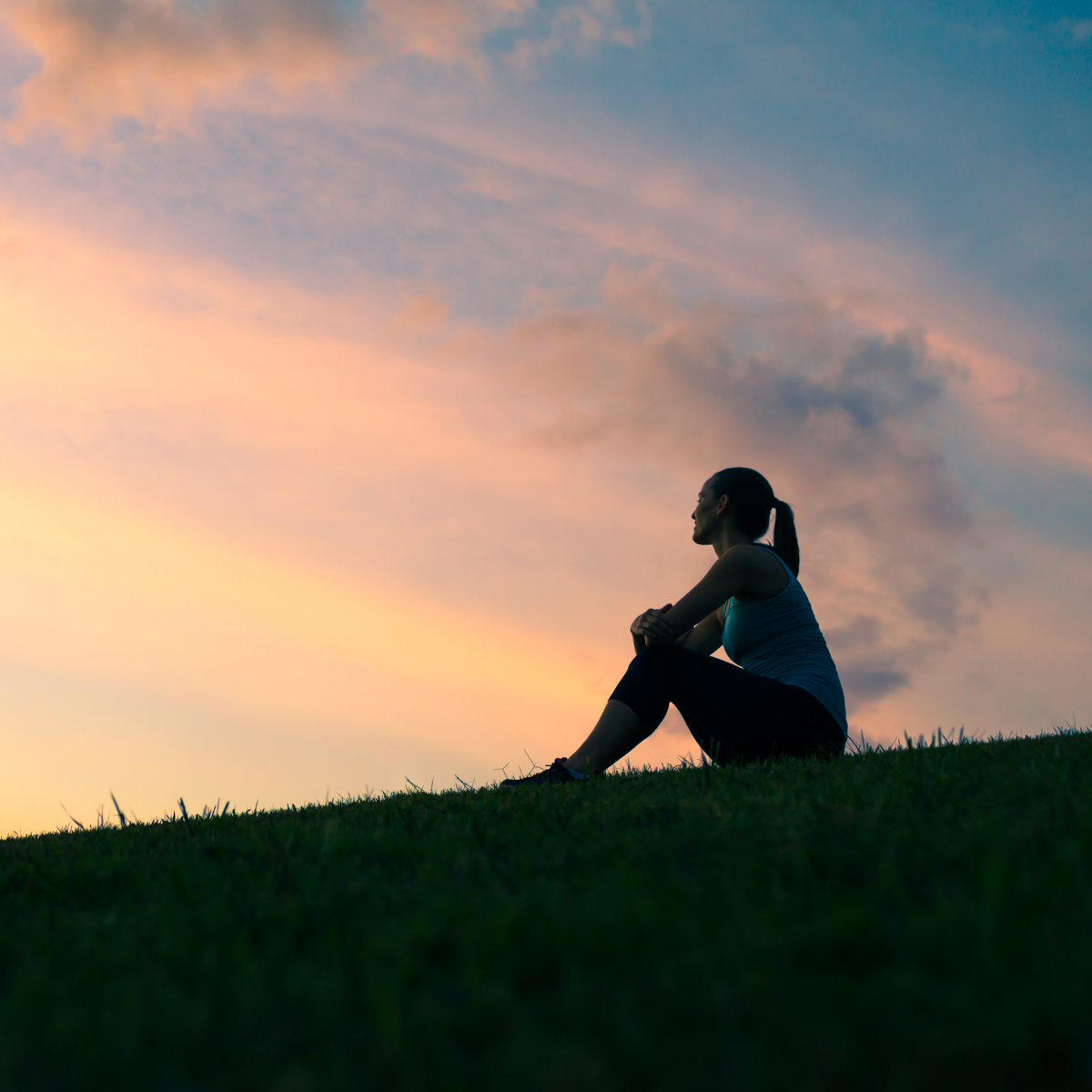 Woman gazing out to the horizon, possibly contemplating weight loss and shame